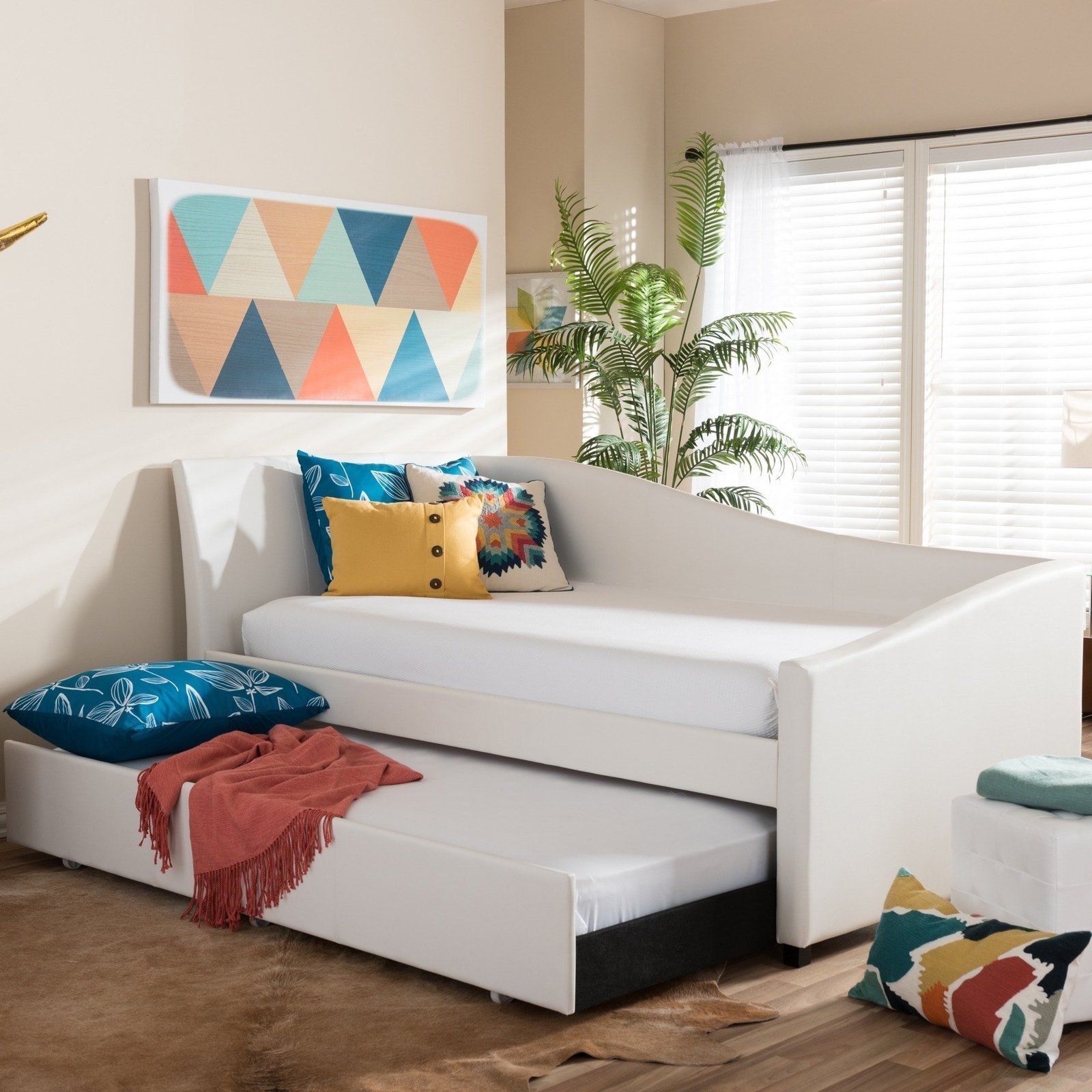 Baxton-Studio-Zoe-Modern-and-Contemporary-White-Faux-Leather-Upholstered-Curved-Sofa-Twin-Daybed-with-Roll-out-Trundle-Guest-Bed-1705abb8-7c1a-4bc8-b248-4ca6475f3b45.jpg